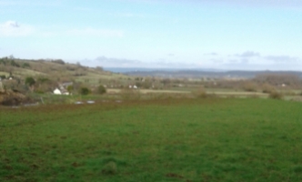 The view from the Huts towards Glastonbury Tor. The Windmill at High Ham can also be seen in another direction.