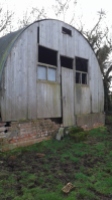 This was the History Hut, before any work. The original brick foundations and base have been retained and repaired.